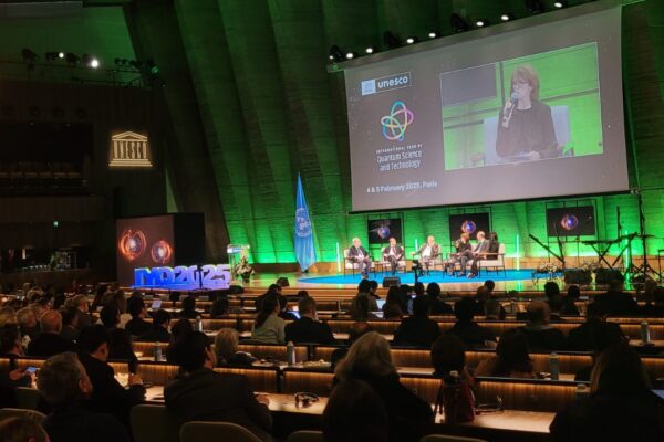 Cathy Foley on stage with panel